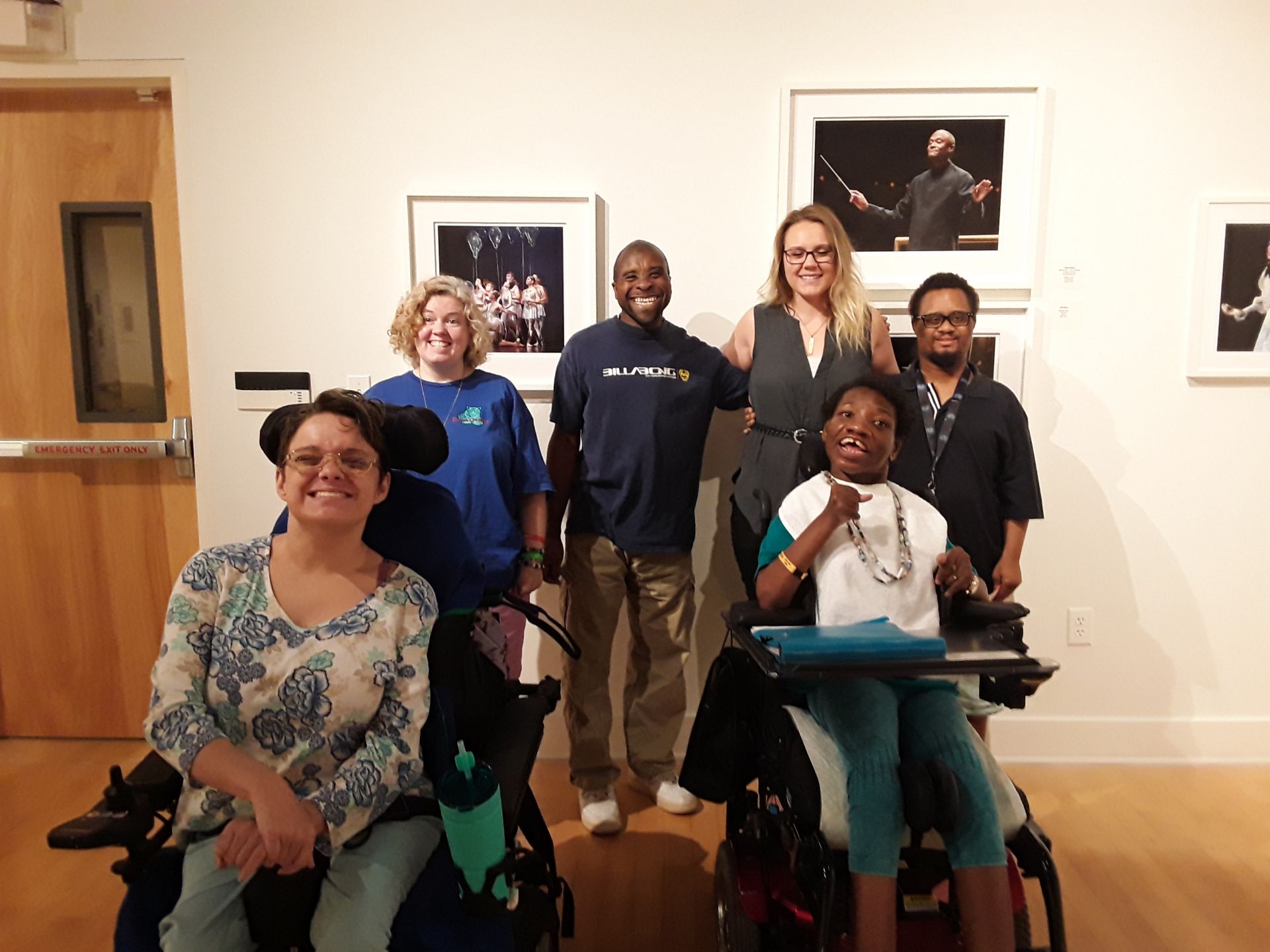 group of people at gallery exhibit